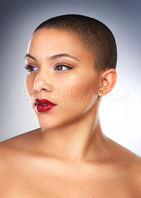 Buy stock photo Studio shot of a beautiful young woman posing with a full face of make-up