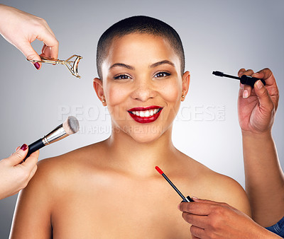 Buy stock photo Shot of hands applying makeup to a young woman's face