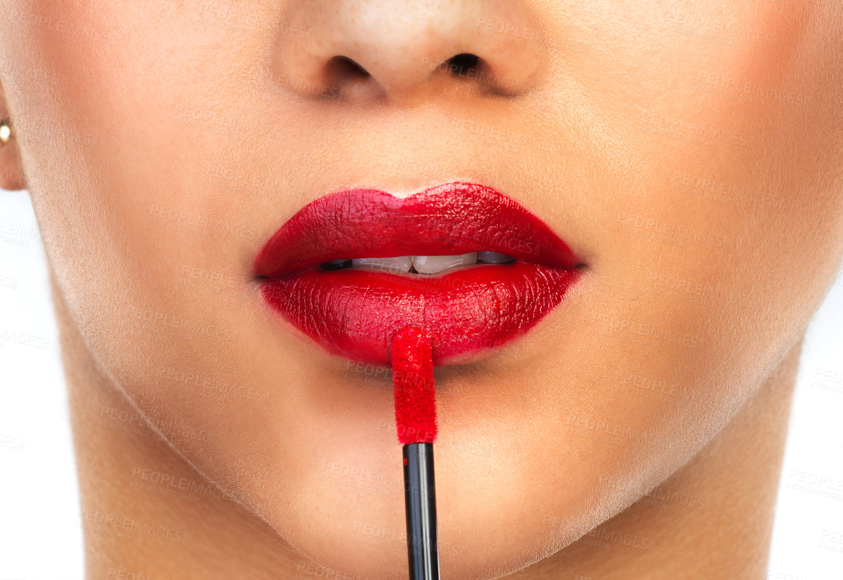 Buy stock photo Cropped shot of an unrecognizable woman applying red lipstick to her lips