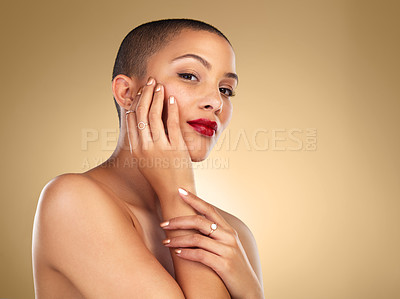 Buy stock photo Studio shot of a beautiful young woman posing against a brown background