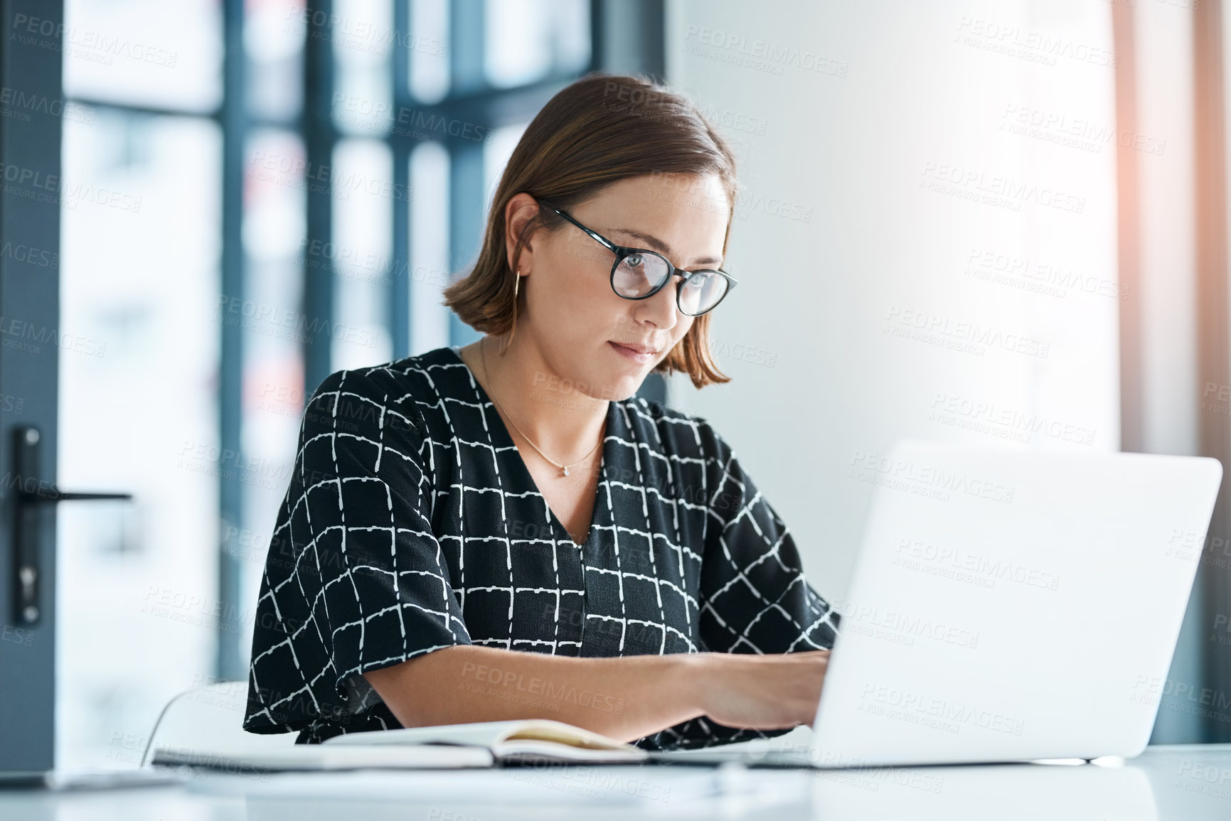 Buy stock photo Office, woman and typing on laptop for proposal email, application and requirements to stakeholder. Grant writer, online and research funding for non profit organization, submission and review.