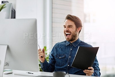 Buy stock photo Cropped shot of a handsome young businessman cheering while sitting in his office