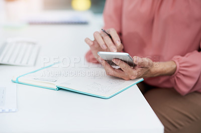 Buy stock photo Woman, hands and phone in office for planning, schedule and calendar update in app for business. Mature assistant, mobile or book at desk for appointment management, company research or communication