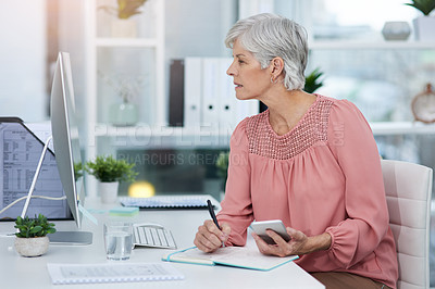 Buy stock photo Shot of a mature woman working in her office