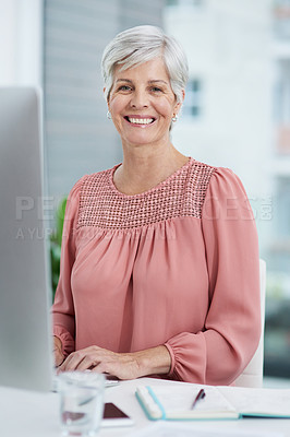 Buy stock photo Portrait of a mature businesswoman working on a computer in her office