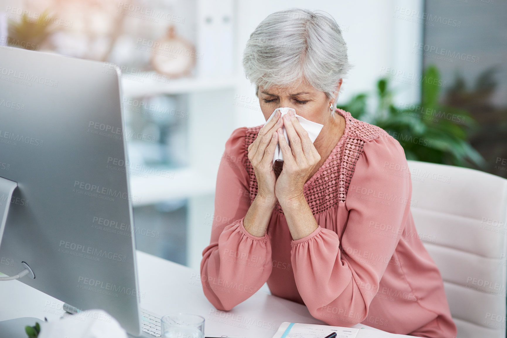 Buy stock photo Sick, blowing nose and mature woman in office with flu, allergy and virus at administration job. Employee, tissue and professional with illness and bacteria issue with hygiene at agency with sinus