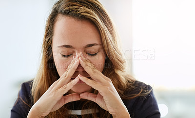 Buy stock photo Shot of an attractive businesswoman looking overly stressed out in her office at work
