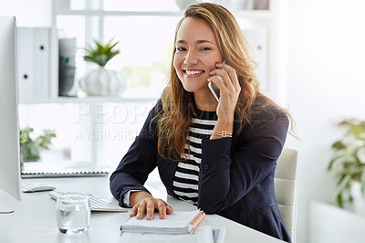 Buy stock photo Portrait of an attractive businesswoman taking a phone call on at her office desk