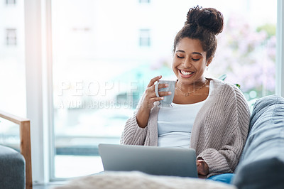 Buy stock photo Cropped shot of an attractive young woman using her laptop to make a video call at home