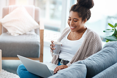 Buy stock photo Cropped shot of an attractive young woman using her laptop to make a video call at home
