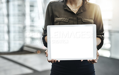 Buy stock photo Cropped shot of an unrecognizable businesswoman displaying a digital tablet in a modern office