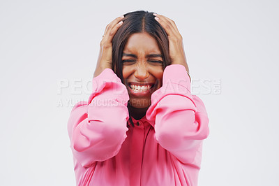 Buy stock photo Studio shot of an attractive young woman looking stressed out against a grey background