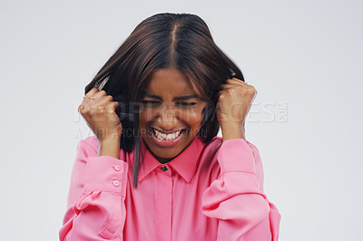 Buy stock photo Psychology, frustrated and woman in studio with mistake, fail or crisis for mental health problem. Worry, emotion and female person pulling hair for tension, pressure or burnout by gray background.