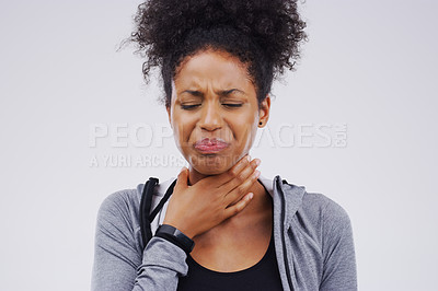 Buy stock photo Black woman, sore throat and virus from cough, allergies or bacteria against a white studio background. Sick African female person touching neck in pain, allergy or flu of cold, illness or infection