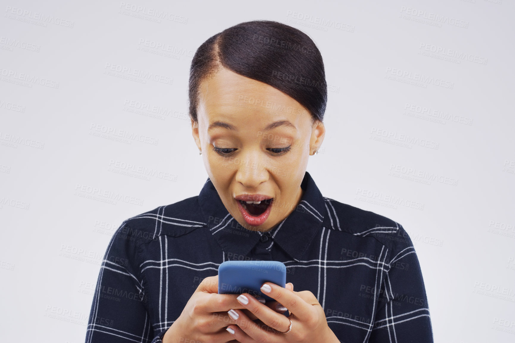 Buy stock photo Woman, surprise and phone of winner in prize or good news against a white studio background. Shocked, surprised or excited female person reading on mobile smartphone for lottery winning, wow or bonus