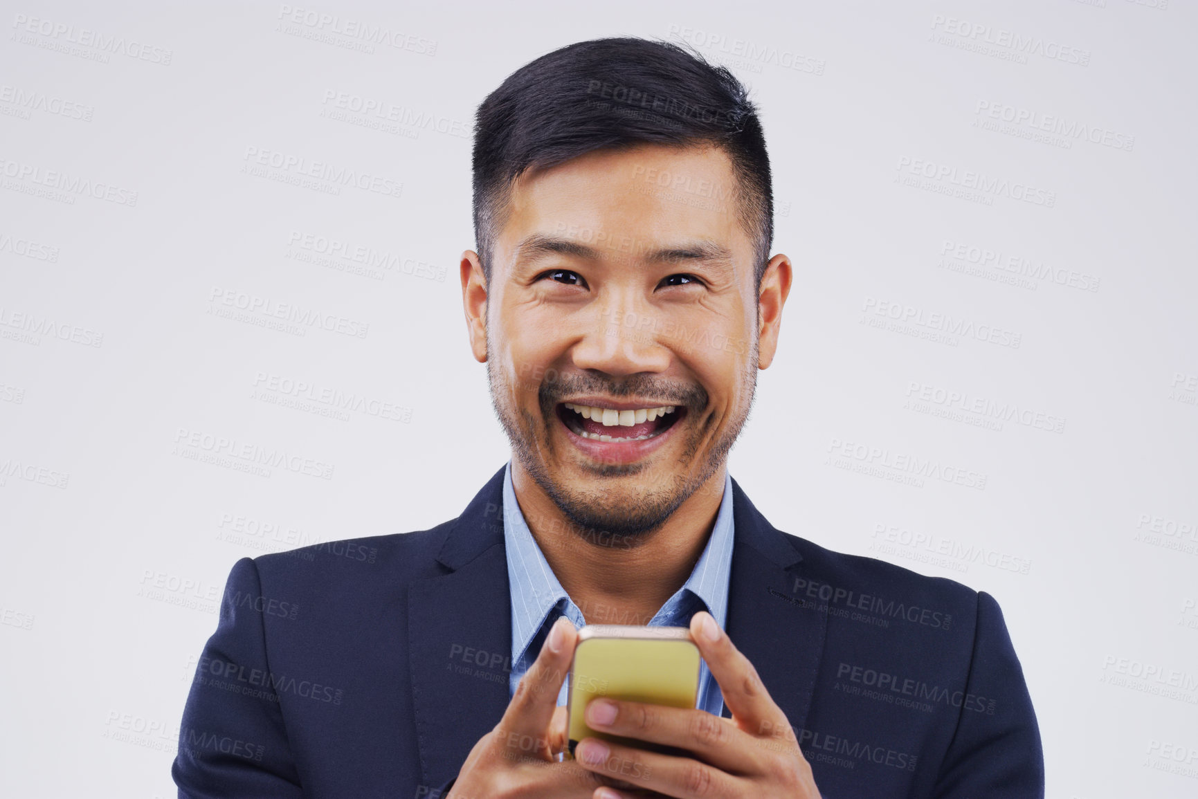 Buy stock photo Portrait, businessman and happy with phone in studio for, social media, networking and smile. Asian male person, technology and excited for message, blog and online for connection by white background