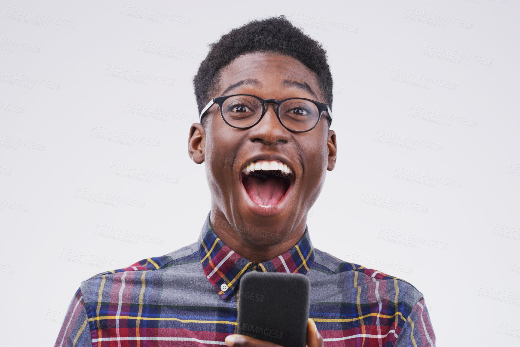 Buy stock photo Black man, surprise and phone for winning, prize or good news against a white studio background. Shocked or surprised African male person on mobile smartphone of winner in wow for lottery competition