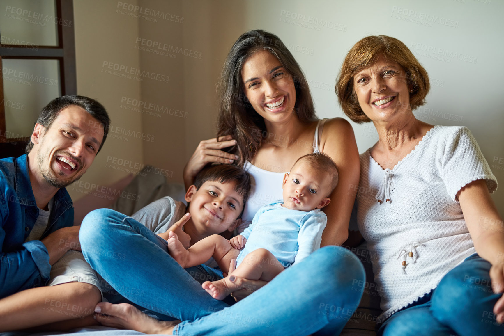 Buy stock photo Portrait of a beautiful family posing together at home