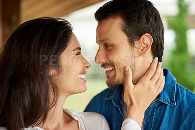 Buy stock photo Shot of an affectionate young couple spending some time together at home