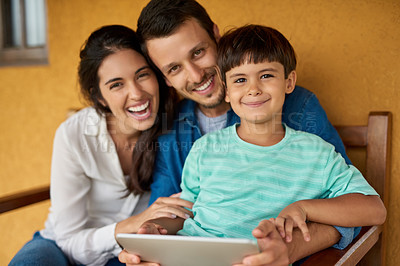 Buy stock photo Portrait of a beautiful young couple and their son using a digital tablet together at home