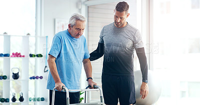 Buy stock photo Shot of a male doctor doing some physiotherapy with a senior patient at hospital