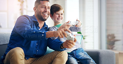 Buy stock photo Father, child and video game on home sofa while happy and excited for challenge and quality time. A man and son or kid together on a couch to play games with a joystick in a family house to relax
