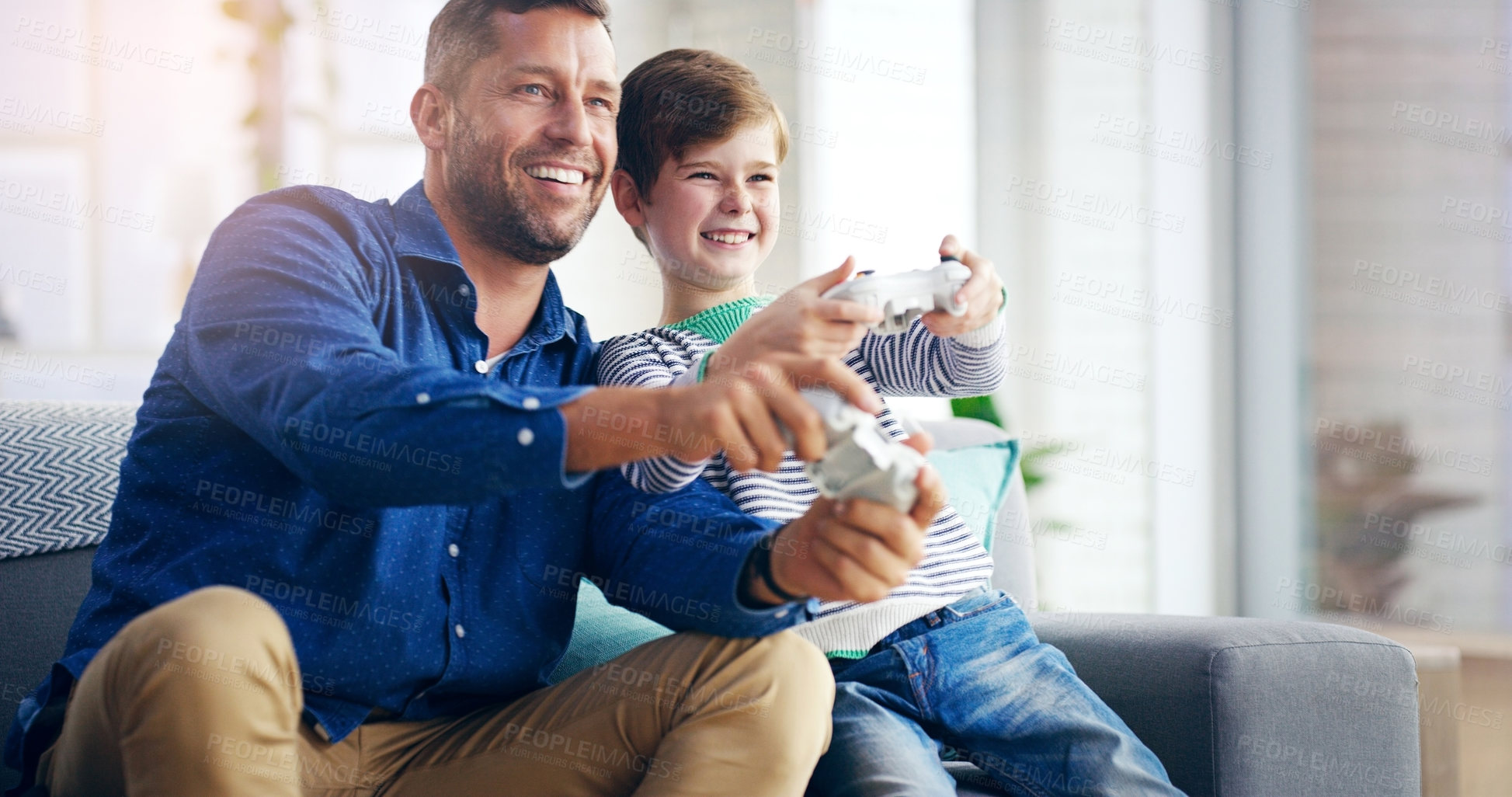 Buy stock photo Father, child and video game on home sofa while happy and excited for challenge and quality time. A man and son or kid together on a couch to play games with a joystick in a family house to relax