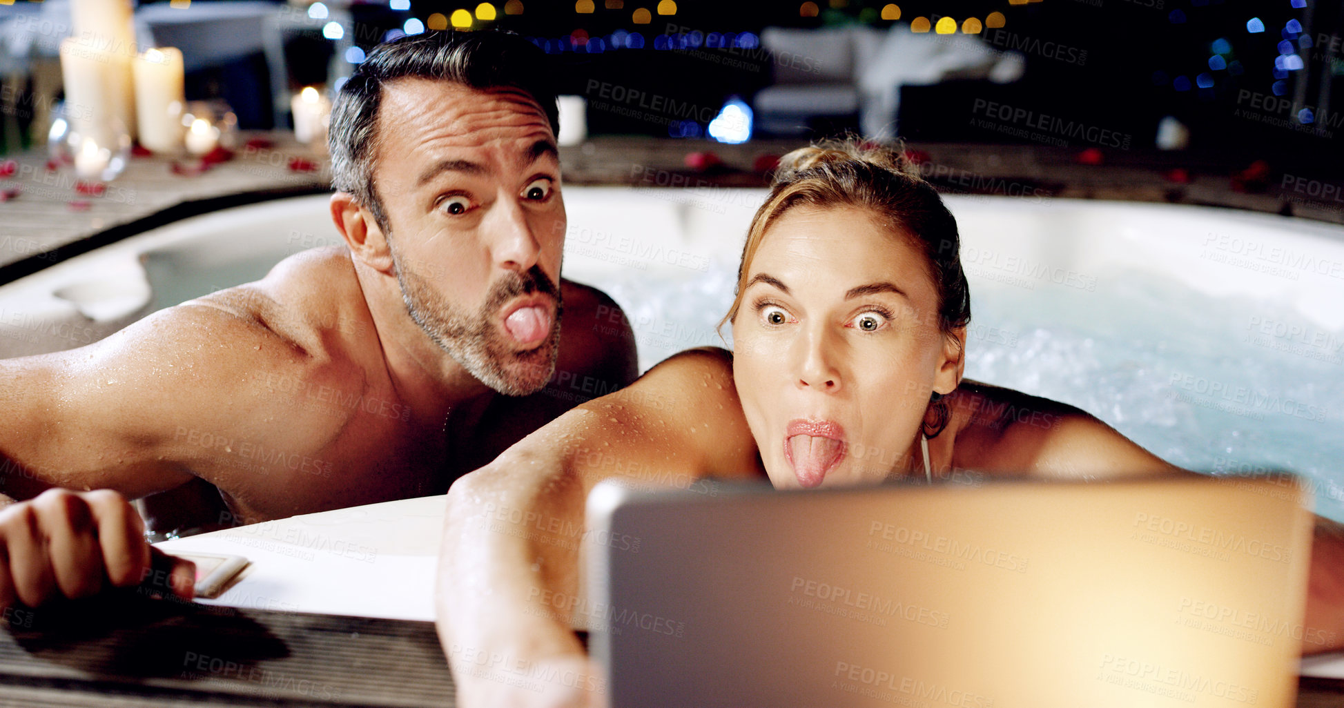 Buy stock photo Tablet, spa and crazy couple take selfie with tongue for social media or the internet or online for a romantic night date. Celebration, web or funny face by people on vacation or holiday in a hot tub