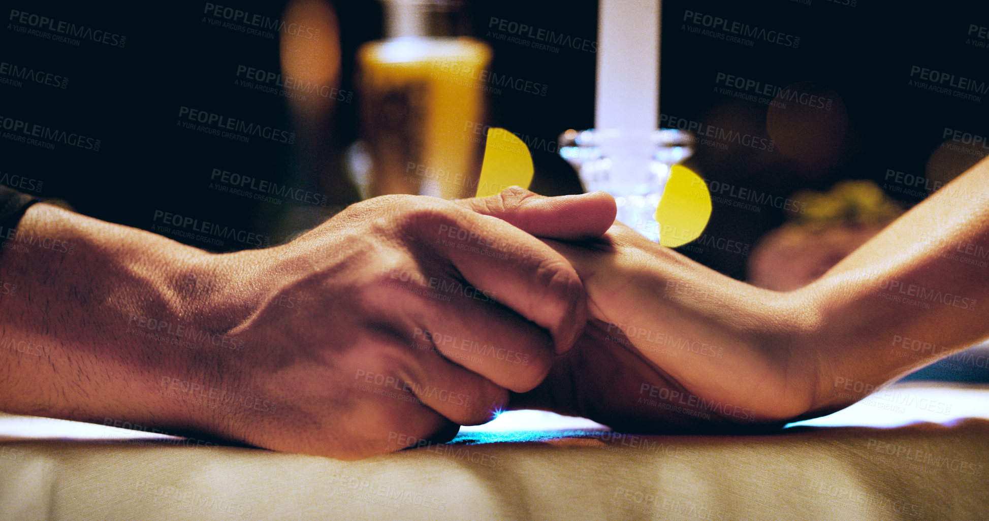 Buy stock photo Holding hands, candle and couple on dinner date at restaurant, hotel or love on marriage anniversary celebration. Man, woman and fine dining together, trust and romance at night with hand closeup 