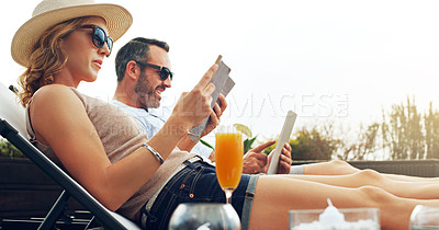 Buy stock photo Reading, morning and couple at resort for holiday, vacation and anniversary celebration at hotel. Marriage, love and man and woman with books, juice and drink outdoors for bonding, romance and relax