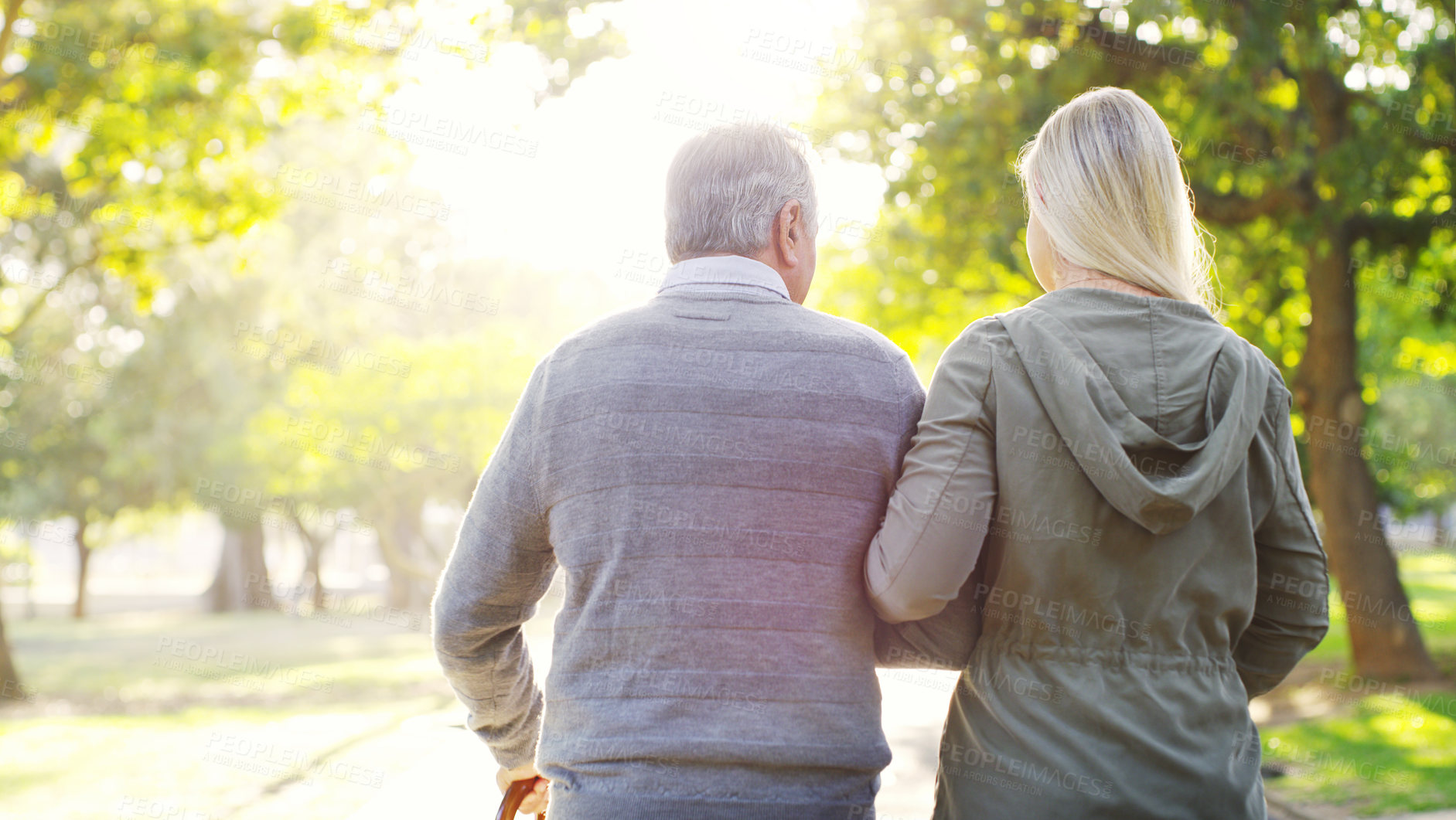 Buy stock photo Senior man, daughter and walking outdoor at a park with love, care and support for health and wellness. A elderly male and woman of family in nature for a walk, quality time and healthy retirement