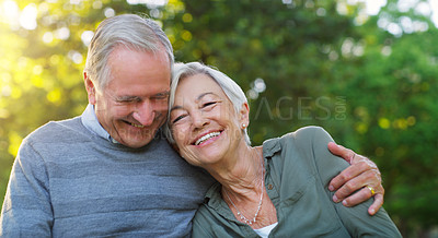 Buy stock photo Laughing, love and senior couple in a park together hugging with care, happiness and romance. Smile, nature and elderly man and woman in retirement embracing while sitting in an outdoor green garden.