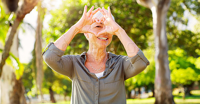 Buy stock photo Portrait, heart hands and a woman in a park for summer, retirement break and calm in Australia. Happy, care and a senior person with a shape gesture to show love, happiness and support in nature