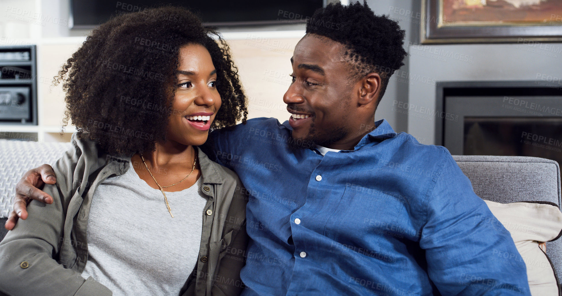 Buy stock photo Shot of an affectionate young couple spending quality time together at home