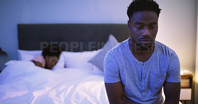 Buy stock photo Black couple, bedroom and man with a problem at night while thinking of divorce, stress or depression. A woman sleeping in bed at home with partner upset about fight, marriage or erectile dysfunction