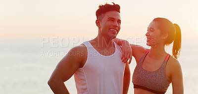 Buy stock photo Cropped shot of an affectionate young couple looking happy while working out outdoors