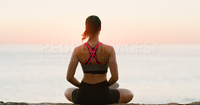 Buy stock photo Rear view, woman and meditation for yoga on beach or wellness, zen and relax for exercise or workout. Young lady, sunset and sea for peace environment, mindfulness or breathing, travel and health 