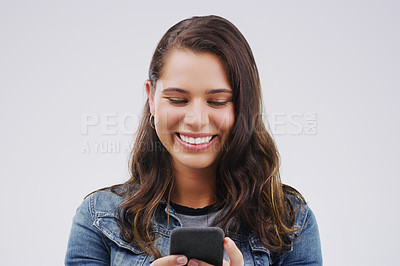 Buy stock photo Smile, contact and woman with a phone, typing and social media on a white studio background. Female person, girl and model with a smartphone, connection and online reading with sms and website info