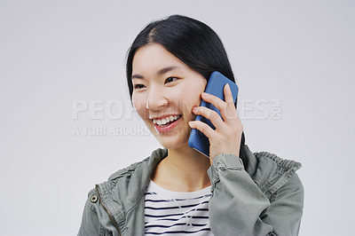 Buy stock photo Smile, phone call and Asian woman talking in studio isolated on a white background with mockup. Funny, cellphone and female person speaking, discussion or communication, conversation and networking.