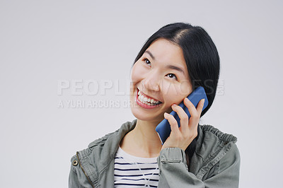 Buy stock photo Phone call, happy and Asian woman in studio smile for conversation, talking and chatting. Communication mockup, white background and female person on smartphone for network, contact and connection