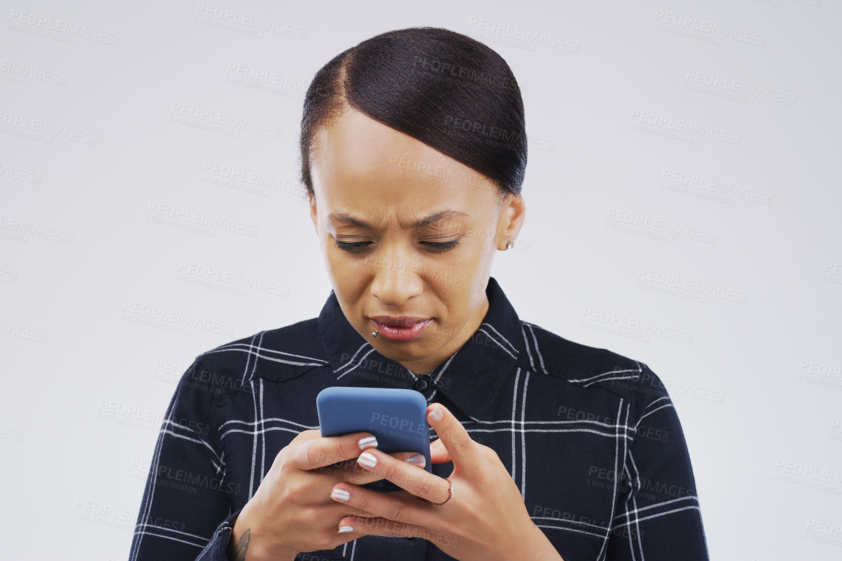 Buy stock photo Confused, phone and woman typing in studio isolated on a white background. Problem, cellphone and female person frustrated on app, fake news or browsing online, social media and glitch, spam or scam.