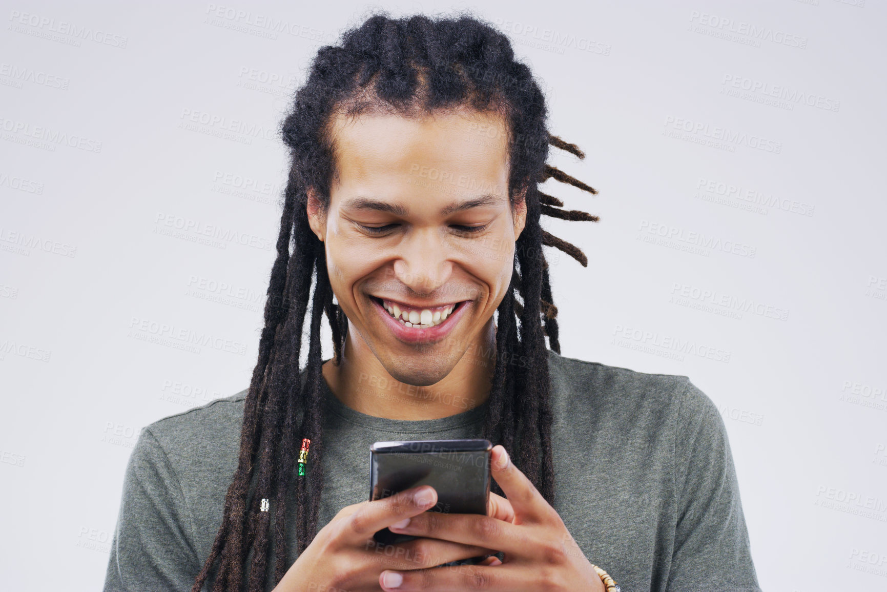 Buy stock photo Phone, happy and black man in studio online with smile for social media, internet and chatting. Communication mockup, white background and male person on smartphone for website, mobile app or network