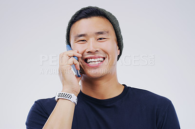 Buy stock photo Phone call, funny and portrait of Asian man talking in studio isolated on white background. Cellphone, laughing and face of male person in communication, speaking or discussion, comedy or comic meme.