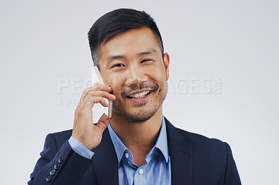 Buy stock photo Phone call, smile and portrait of Asian man talking in studio isolated on a white background. Cellphone, happy and face of business person in communication, speaking or discussion, network and chat.