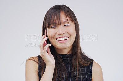 Buy stock photo Phone call, talking and Asian woman in studio smile for conversation, speaking and chatting. Communication mockup, white background and female person on smartphone for network, contact and connection