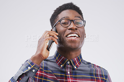 Buy stock photo Phone call, portrait and excited black man in studio for conversation, talking and funny chat. Communication mockup, white background and male person on smartphone for network, contact and connection