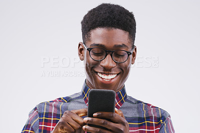 Buy stock photo Phone, happy and face of black man in studio with smile for social media, internet and online chat. Communication, white background and male person on smartphone for website, mobile app and texting
