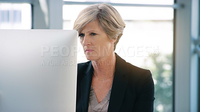 Buy stock photo Businesswoman, mature and computer on desktop for corporate job, internet connection and reading email. Expertise, tech and face of senior ceo in office with web, checking schedule and executive work