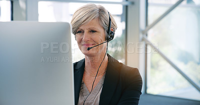 Buy stock photo Call center, computer and headset with mature telemarketing employee in office for consulting. Contact us, customer service and support with happy business woman in workplace for assistance or help