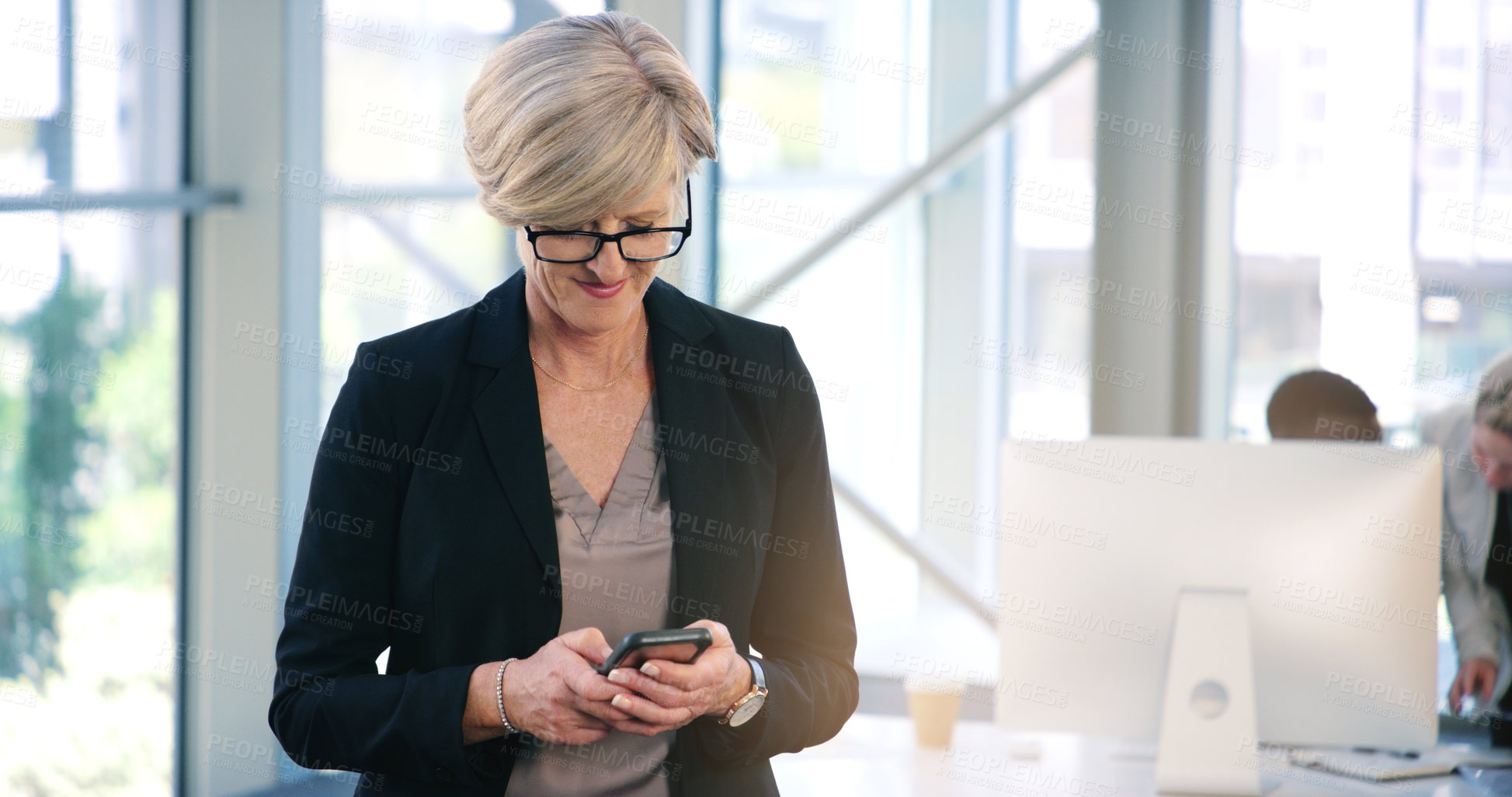 Buy stock photo Mature woman, smile and cellphone in office for typing, browsing and texting online with contact. Technology, connectivity and hr manager with mobile for networking, social media or business person